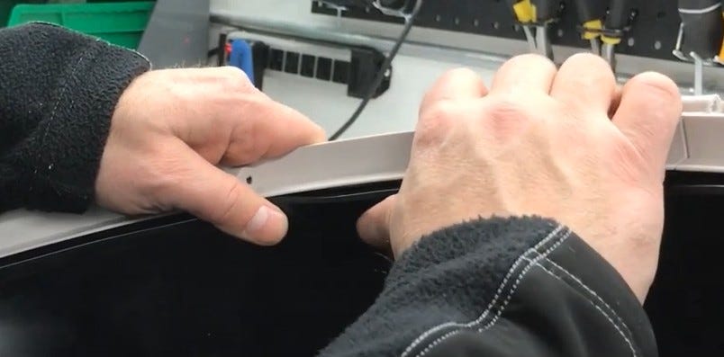 Inserting the liner ridge into the channel