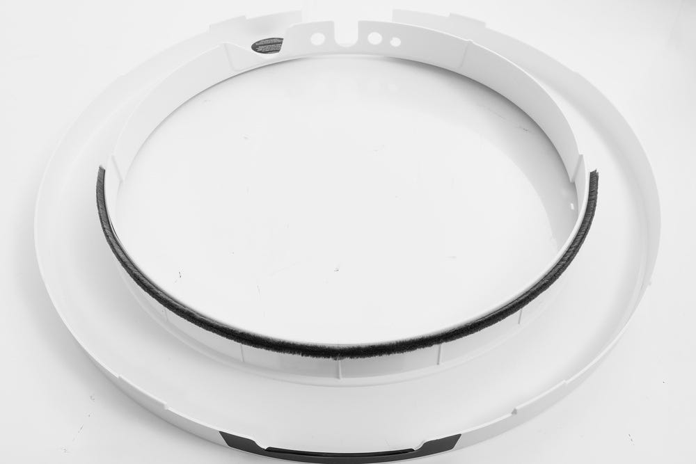Litter-Robot 5 bezel removed from unit and placed face down with seal strip installed along bezel edge