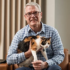 Brad Baxter holding cat
