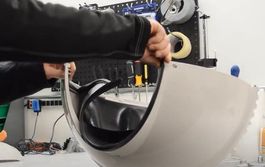 Peeling back and unhooking the liner