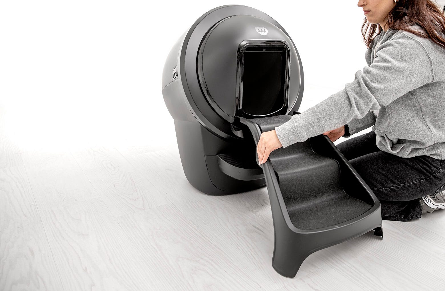 Aligning the ramp with the hinge and pressing down to snap in place