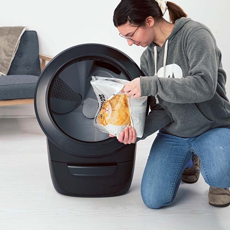 Pouring litter into globe