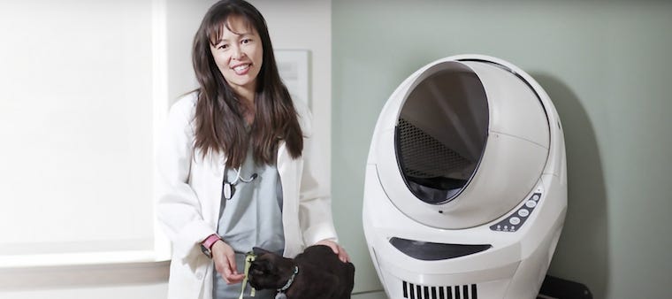 Dr. Justine Lee with black cat next to Litter-Robot