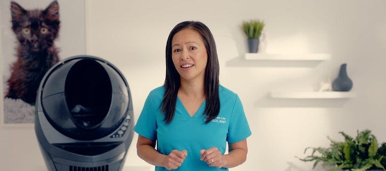Dr Justine Lee standing near a Litter-Robot