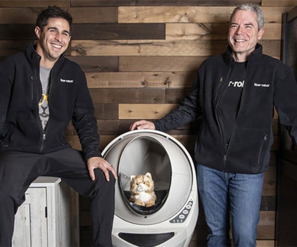 Smiling Brad Baxter and Jaconb Zuppke with Litter-Robot