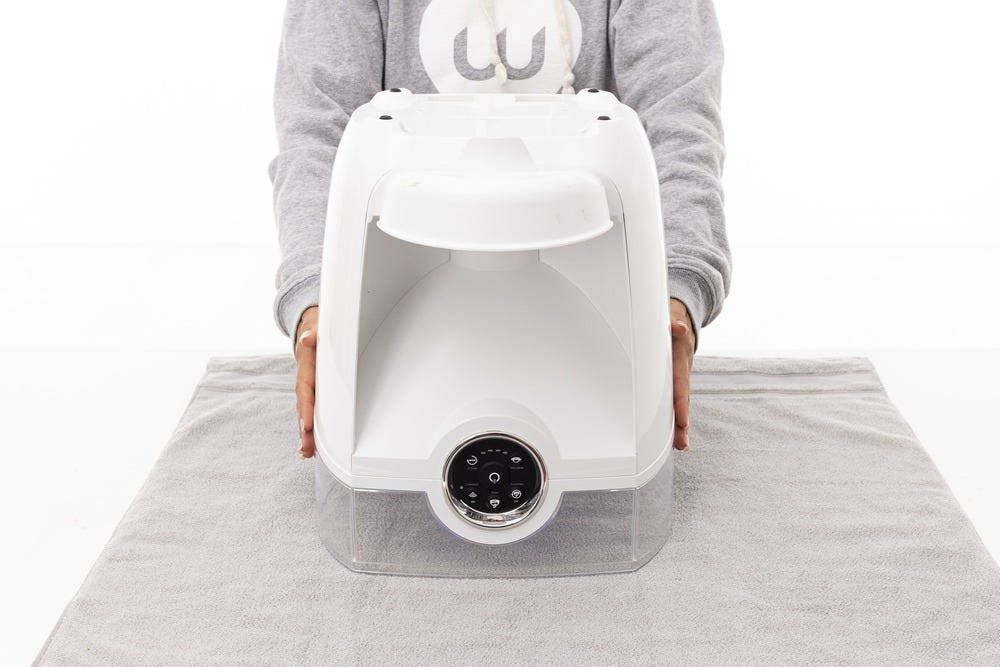 Flipping Feeder-Robot upside down, onto the towel.