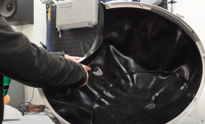 Removing the screw and nut from the liner