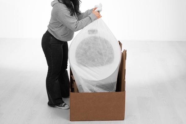 Placing Litter-Robot into the bottom tray