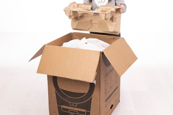 Folding and placing the molded inserts in the top of the box