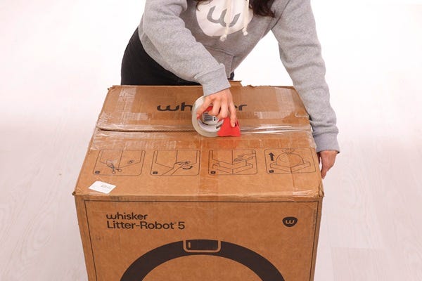 Taping box shut along seam