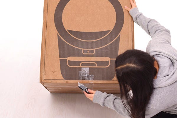 Cutting tape alone the bottom of box