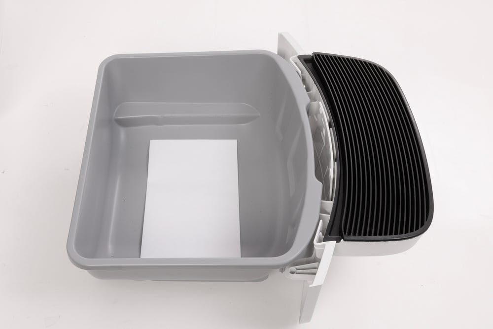 White piece of paper inside waste drawer