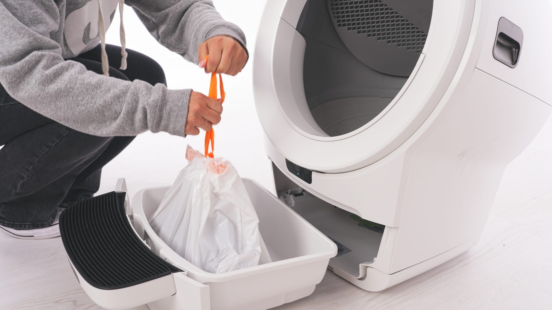 Removing dirty waste drawer liner