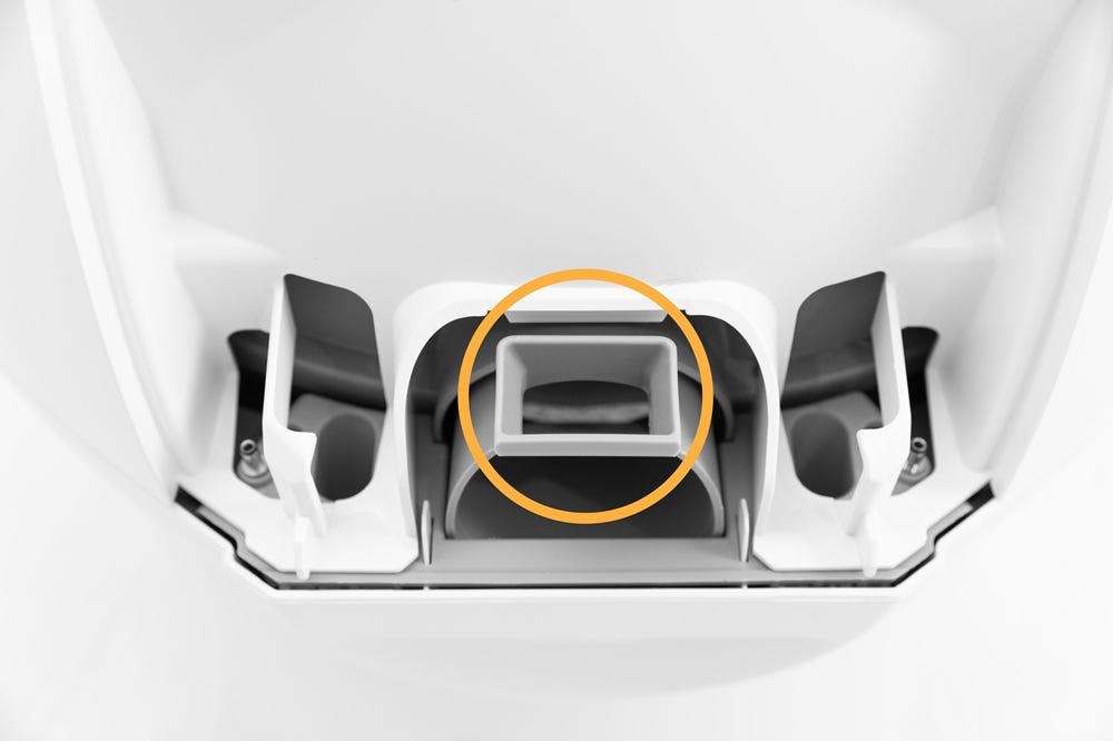 Circular pockets on right side of bonnet hinge