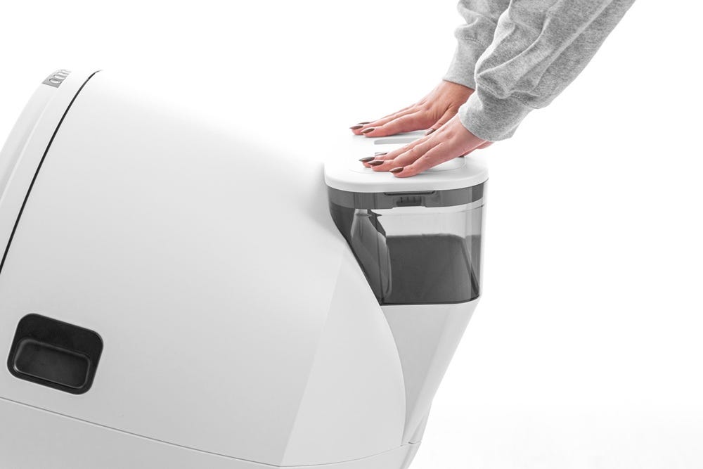 LitterHopper lid being installed with two hands pressing down
