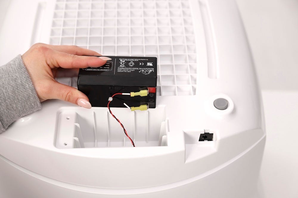 Battery positioned above cavity