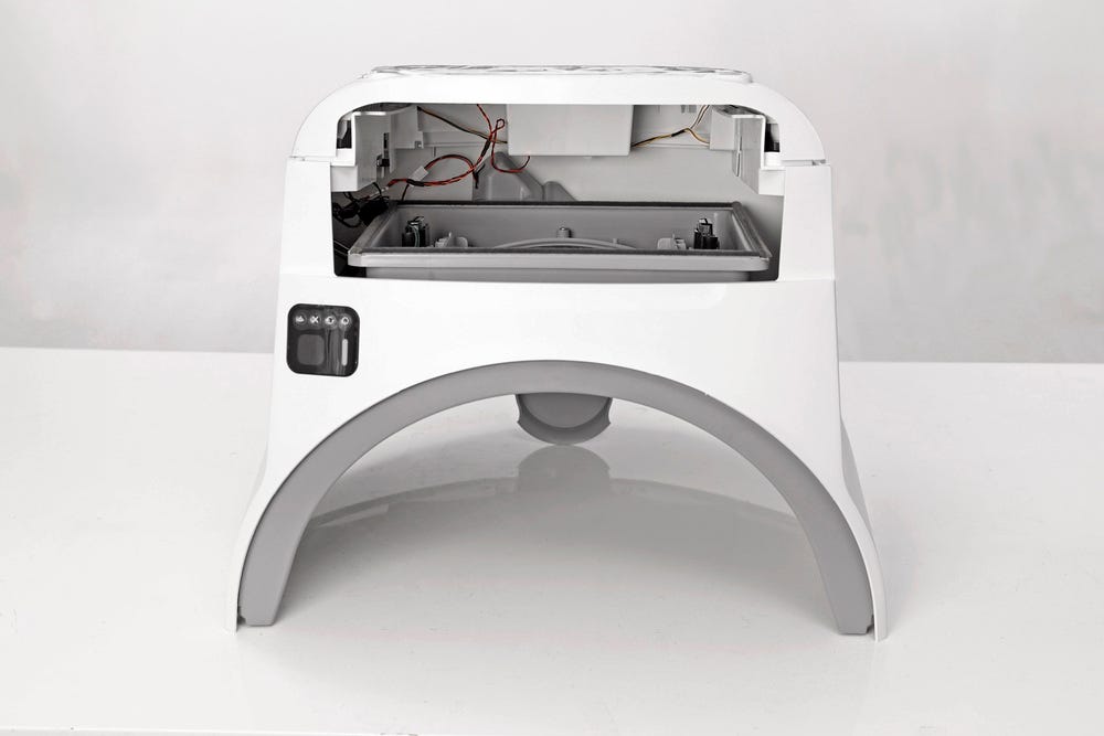Litter-Robot EVO base upside down with drawer, bonnet, and globe removed