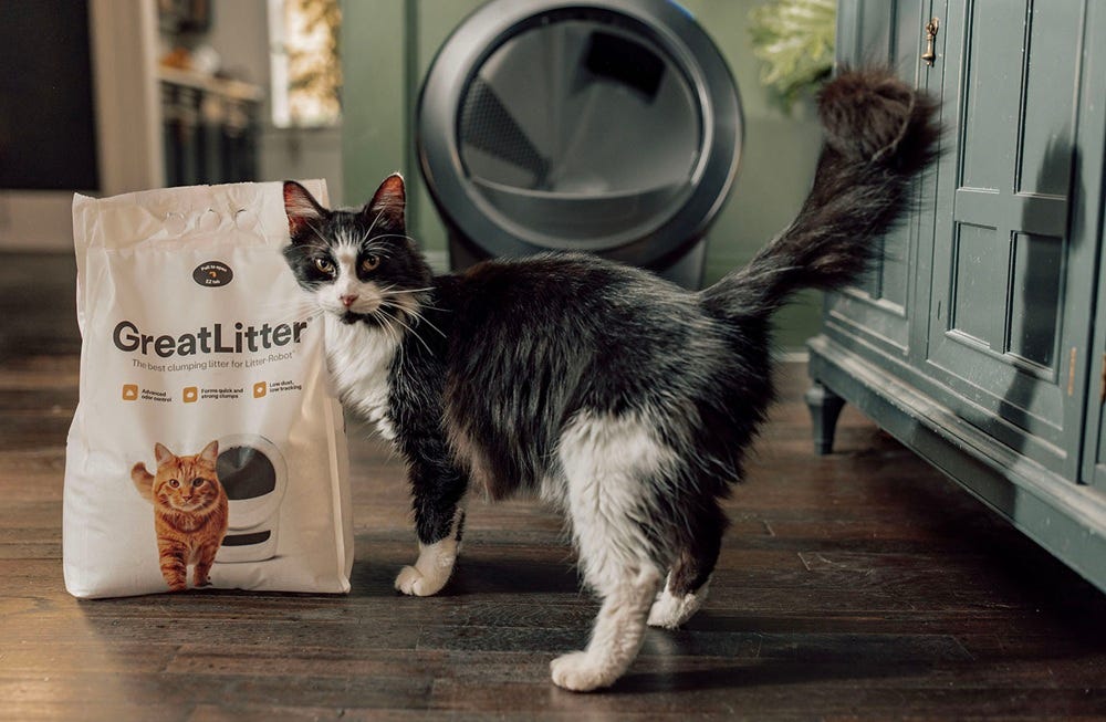 Bag of cat litter with black and white cat