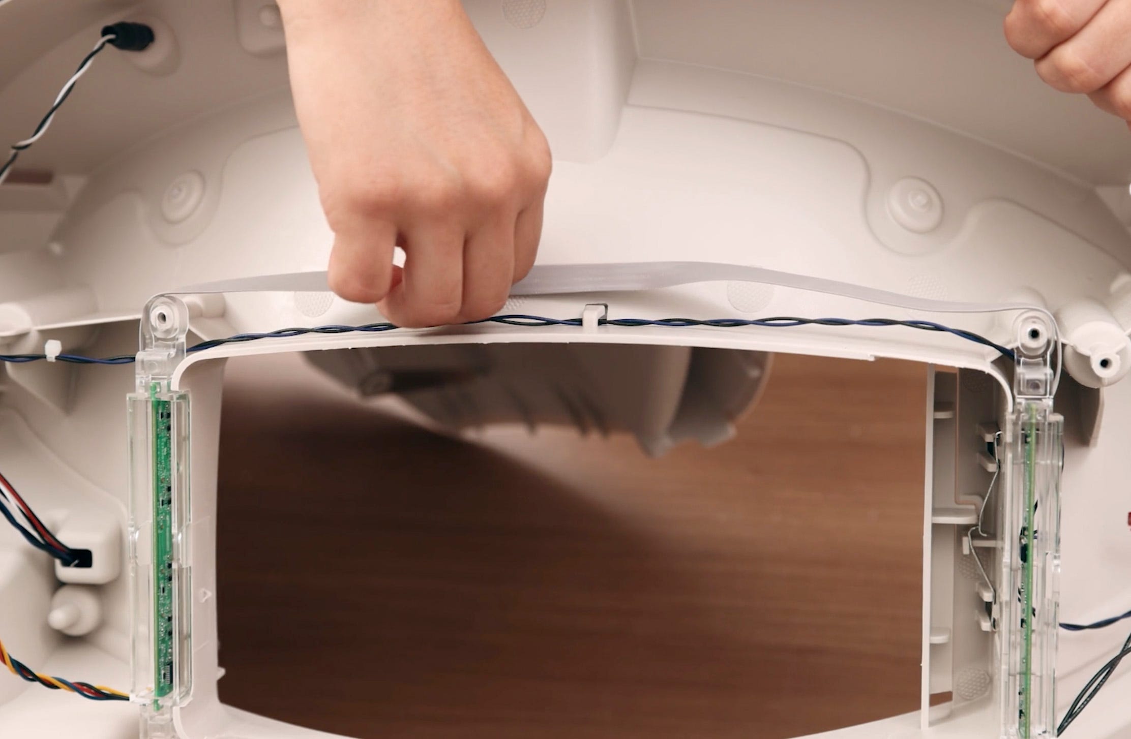 Freeing gray ribbon cable from retainer hook