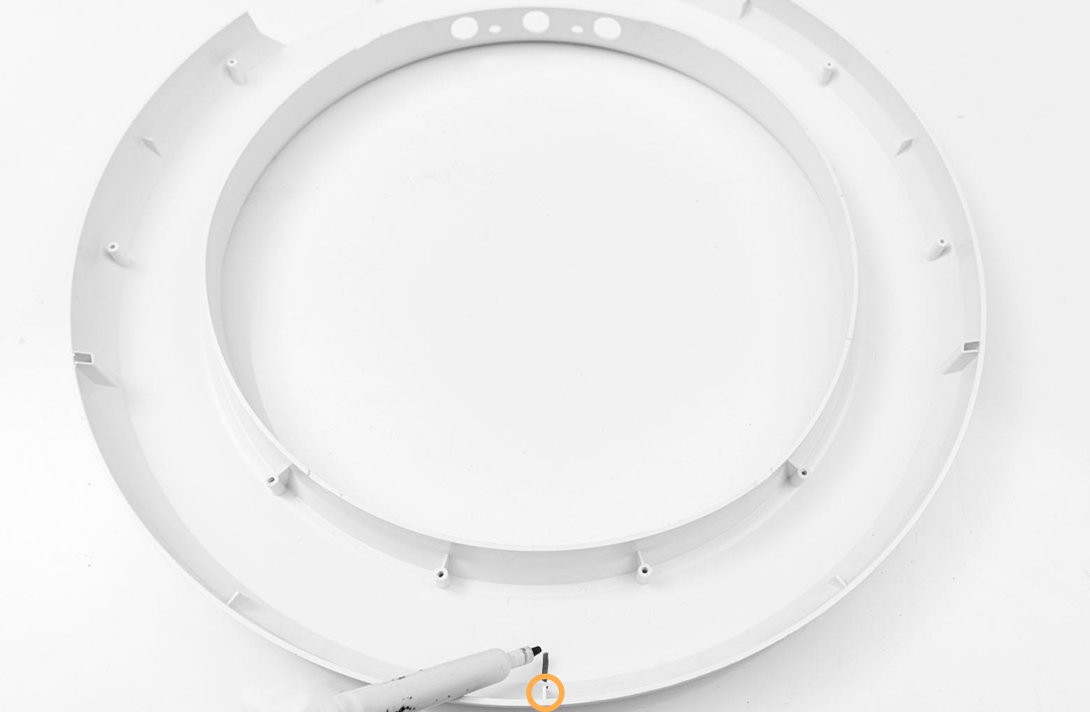 The bezel rib below the strips